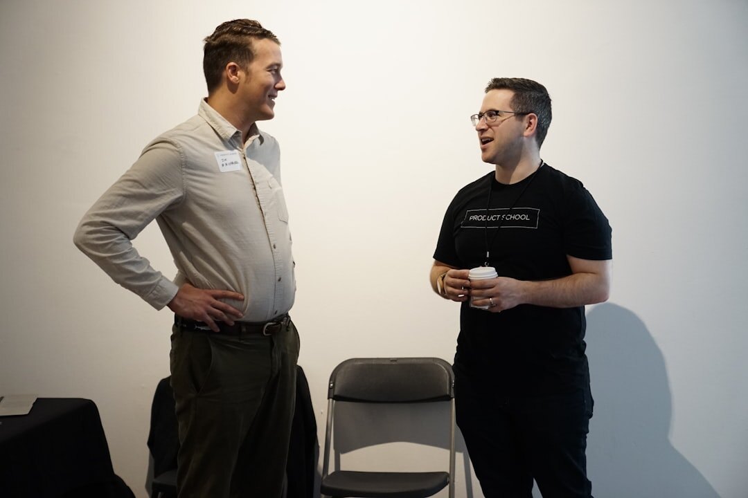 two men talking quietly