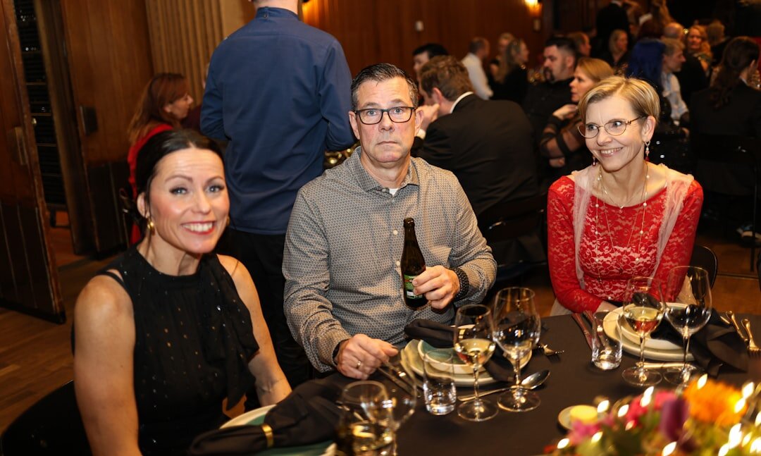 group of celebrities at dinner